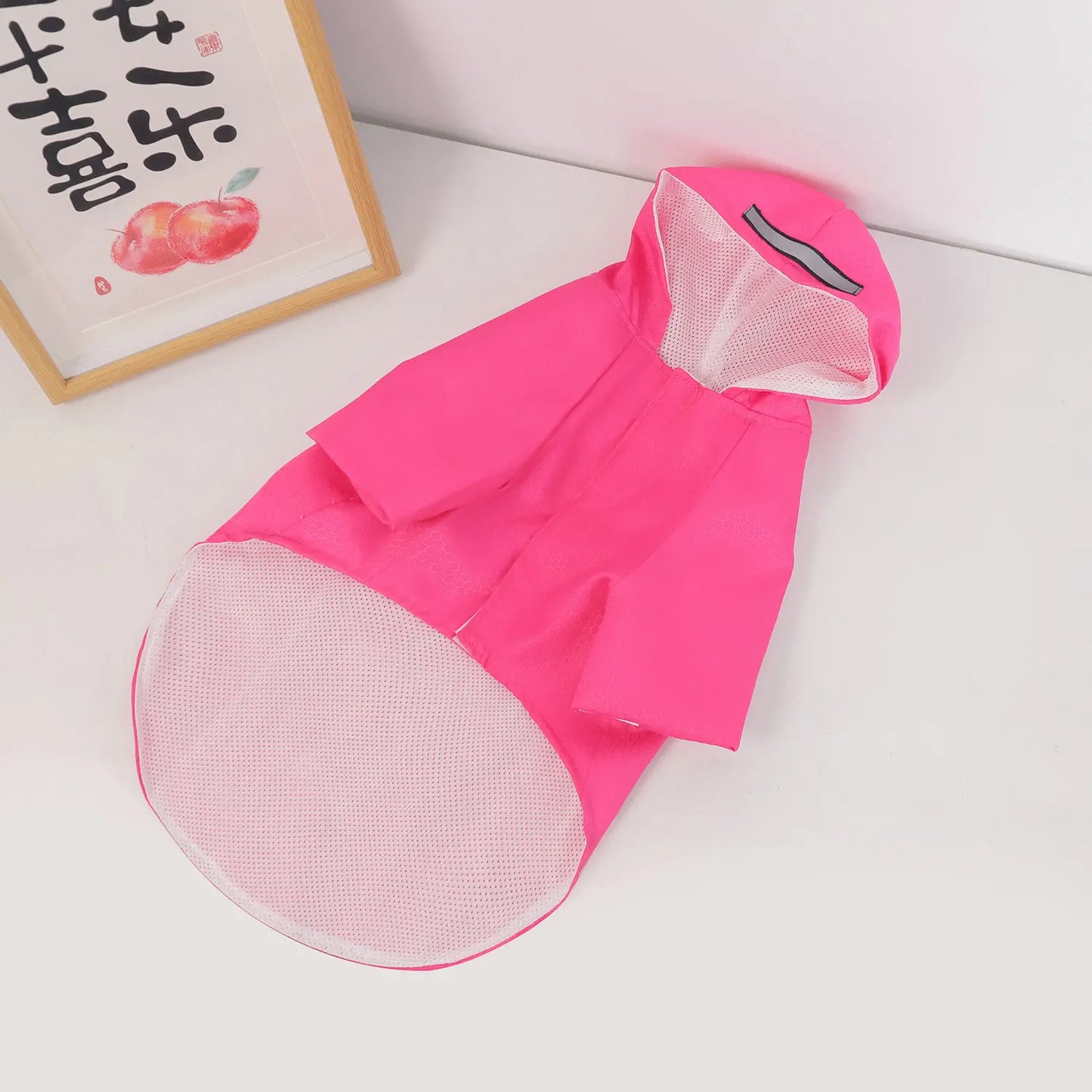 Pink waterproof dog raincoat with reflective stripes